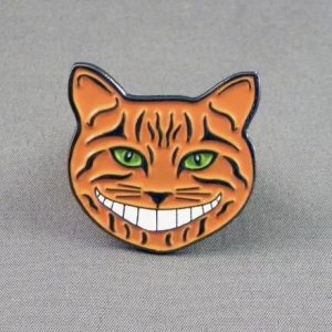 CHESHIRE CAT PIN BADGES WITH GLOW IN THE DARK SMILE